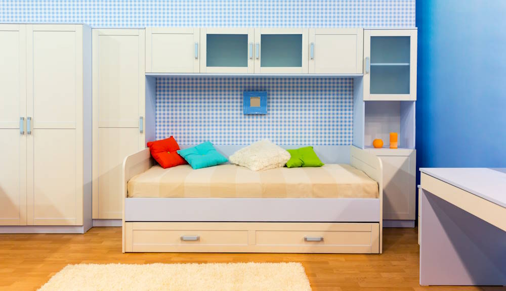 Bright bedroom with a bed and cupboard